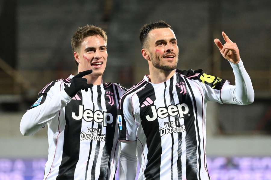 Juventus’ Filip Kostic (right) celebrates with Kenan Yildiz