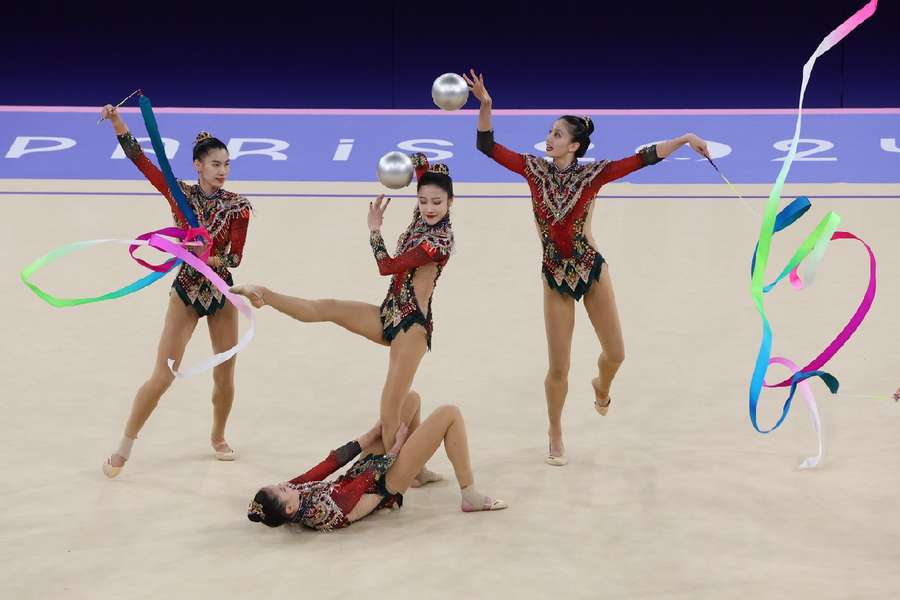 The Chinese gymnasts performing