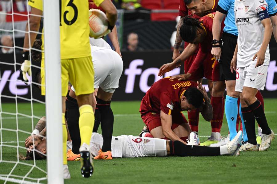 Nemanja Gudelj holds his head after an early injury scare