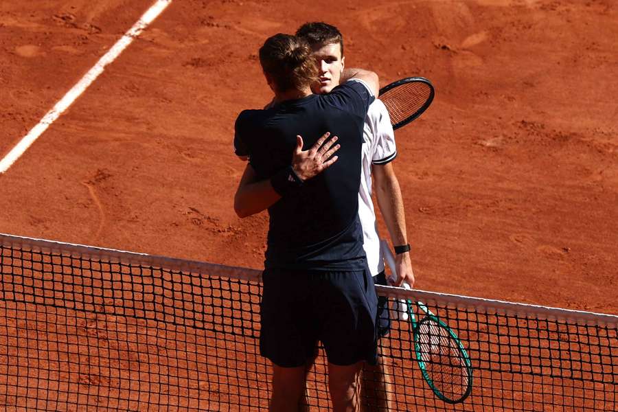 Jakub Mensik and Alexander Zverev embrace after the match