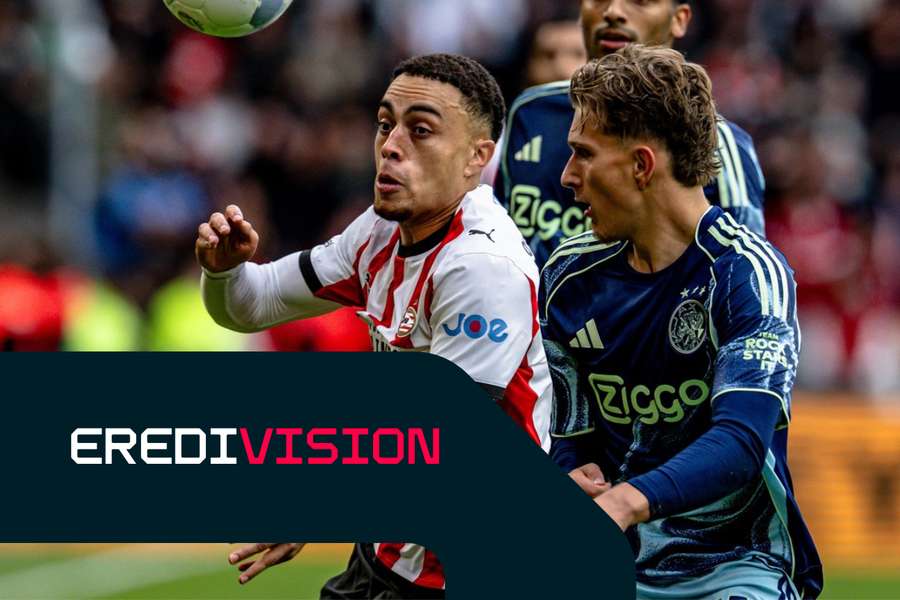 PSV's Sergino Dest and Ajax winger Mika Godts fight for the ball during Sunday's derby