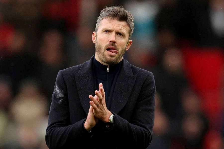 Manchester United manager Michael Carrick looks dejected as he applauds fans after the match