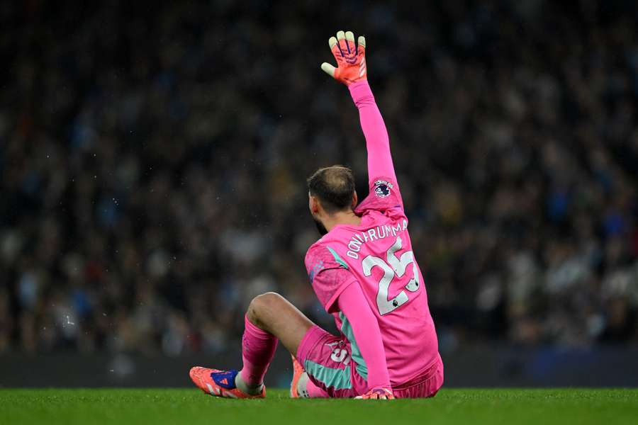 Gianluigi Donnarumma goes down with an apparent injury against Leeds Gianluigi Donnarumma goes down with an apparent injury against Leeds
