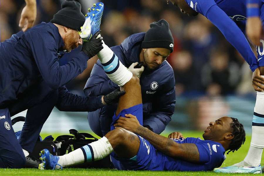 Chelsea's Raheem Sterling receiving medical attention after sustaining an injury