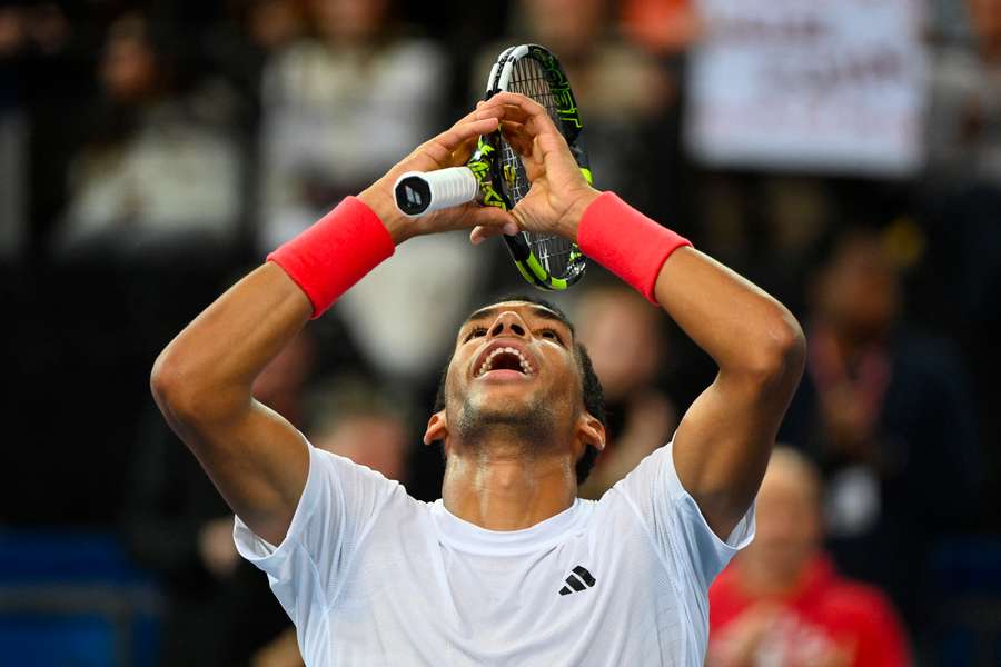 Auger-Aliassime celebrates his victory after claiming the title in Montpellier