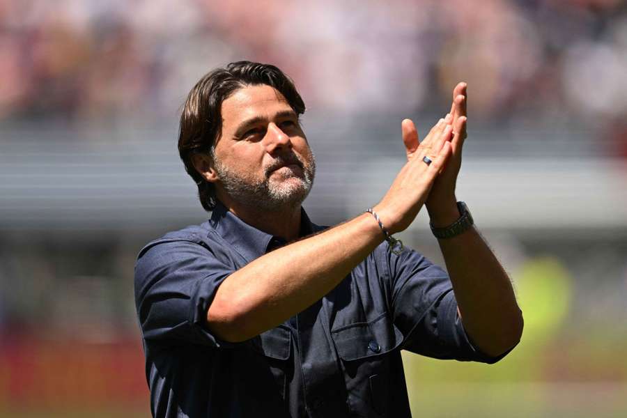Mauricio Pochettino celebrates with the fans after the game Mauricio Pochettino celebrates with the fans after the game