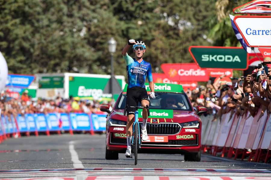 Ben O'Connor celebrates crossing the finish line in first place at the end of the stage six of the Vuelta