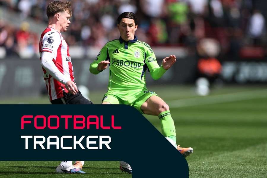 Keane Lewis-Potter battles for the ball with Harry Wilson