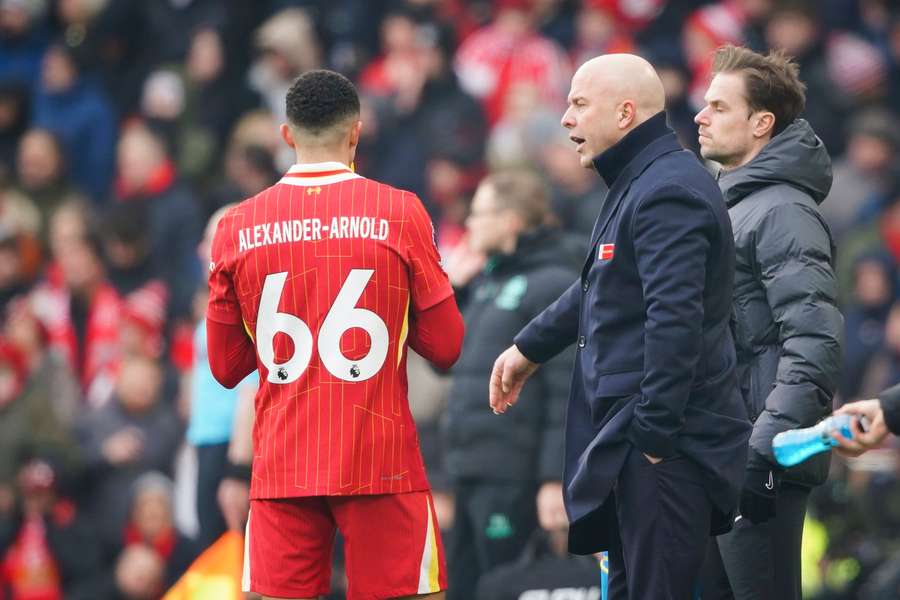 Slot (right) has given an update on Trent Alexander-Arnold