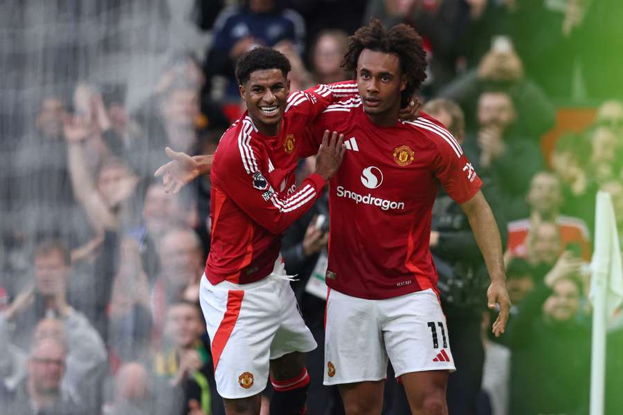 Manchester United striker Joshua Zirkzee (R) celebrates with Marcus Rashford