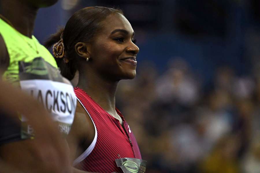 Britain's Dina Asher-Smith reacts after her victory