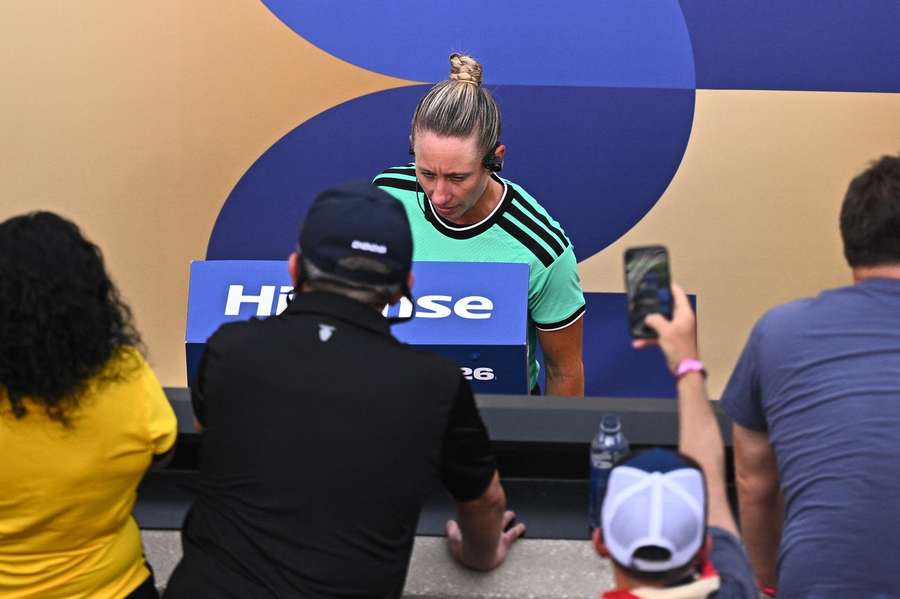Referee Tori Penso reviews a potential foul in the Ecuador vs. Germany game