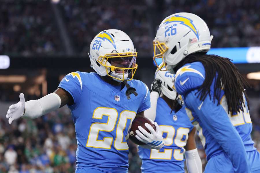 Cam Hart, Donte Jackson and Tarheeb Still of the Chargers celebrate Hart's interception during the fourth quarter against the Eagles Cam Hart, Donte Jackson and Tarheeb Still of the Chargers celebrate Hart's interception during the fourth quarter against the Eagles