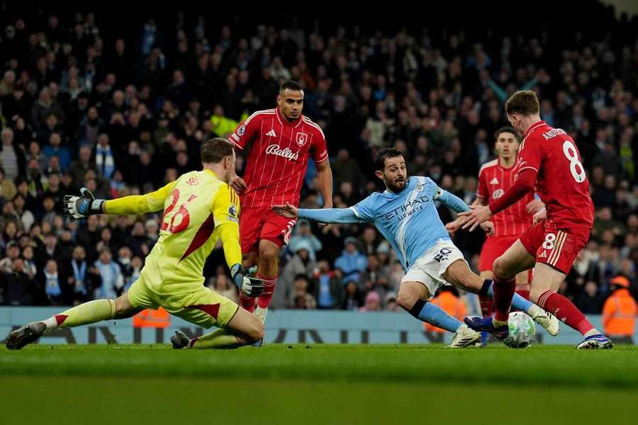Manchester City's Bernardo Silva has a shot blocked against Nottingham Forest