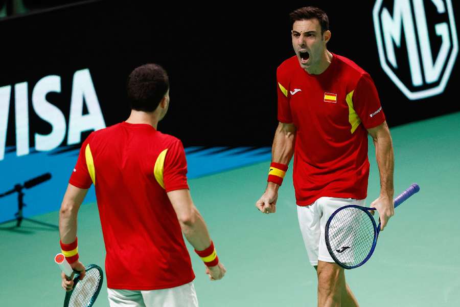 Spain celebrate doubles win to book final spot