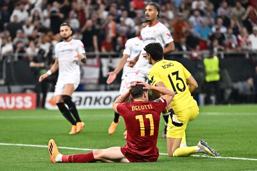 Yassine Bounou makes a save in front of Roma's Andrea Belotti