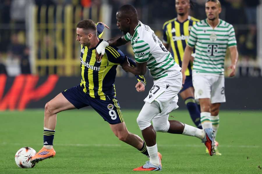 Fenerbahce's Kerem Akturkoglu tussles for the ball with Ferencvaros' Ibrahim Cisse Fenerbahce's Kerem Akturkoglu tussles for the ball with Ferencvaros' Ibrahim Cisse