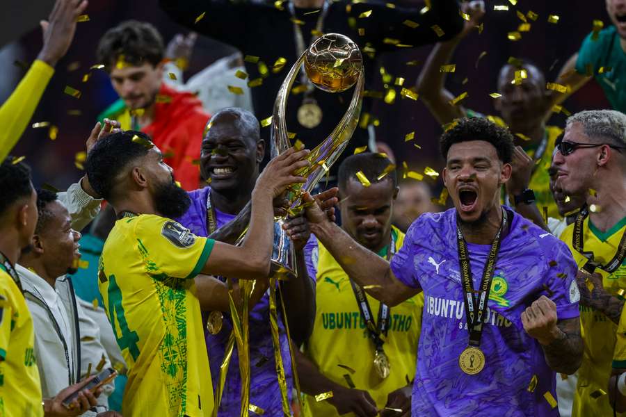 Sundowns players celebrate with the trophy