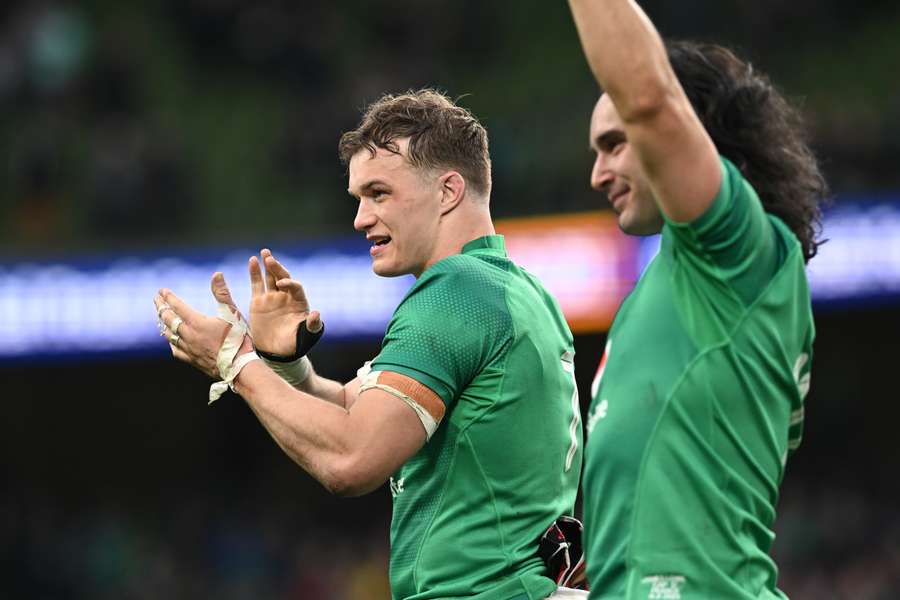 Ireland's flanker Josh van der Flier celebrates on the pitch after the victory