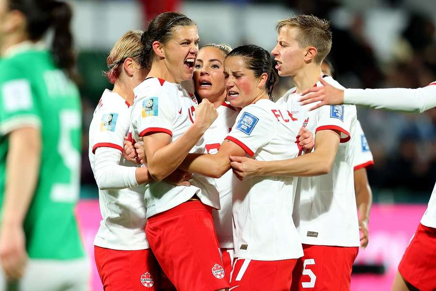 Canada celebrate scoring against Ireland