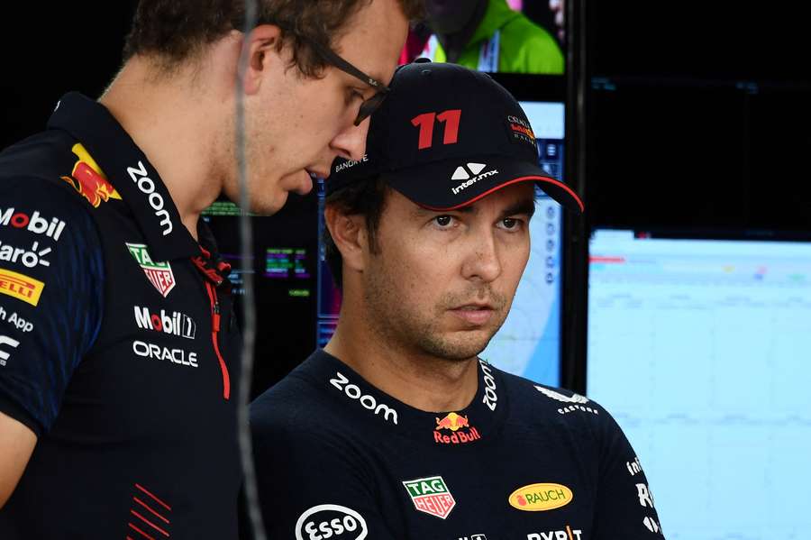 Red Bull's Sergio Perez (R) ahead of the second practice session