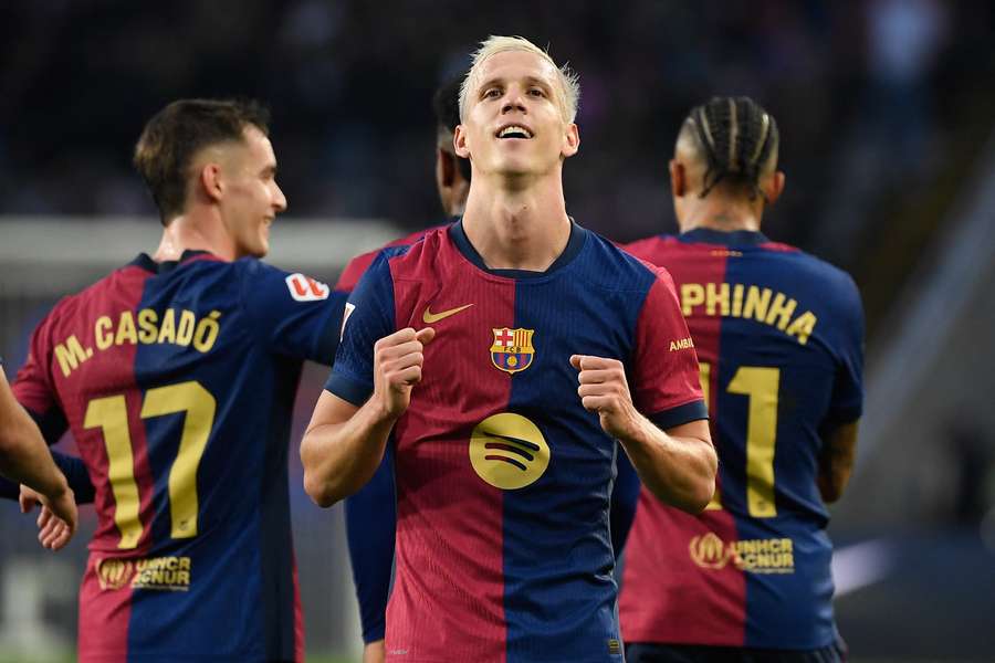 Dani Olmo (centre) celebrates scoring for Barcelona