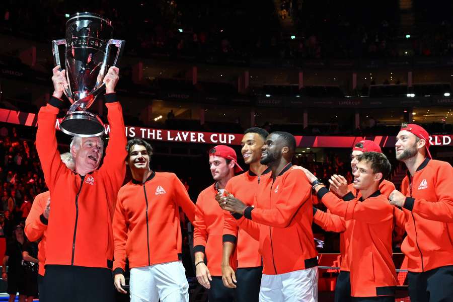 Team World captain John McEnroe (L) lifts the trophy after victory over Team Europe in the Laver Cup at the O2 Arena in London.