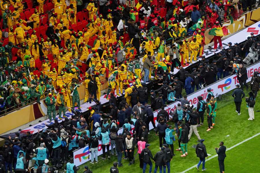 Senegal fans react in the stand after Morocco were awarded a penalty following a VAR review during the AFCON final
