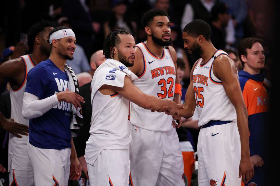The New York Knicks celebrate after eliminating the defending champion Boston Celtics in six games.