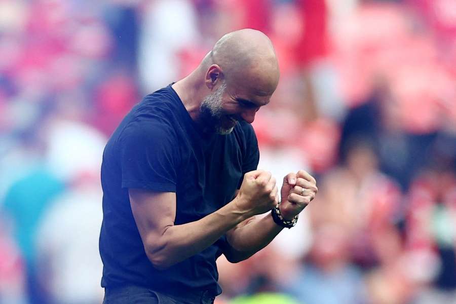 Boss Pep Guardiola clenches his fists after City's win