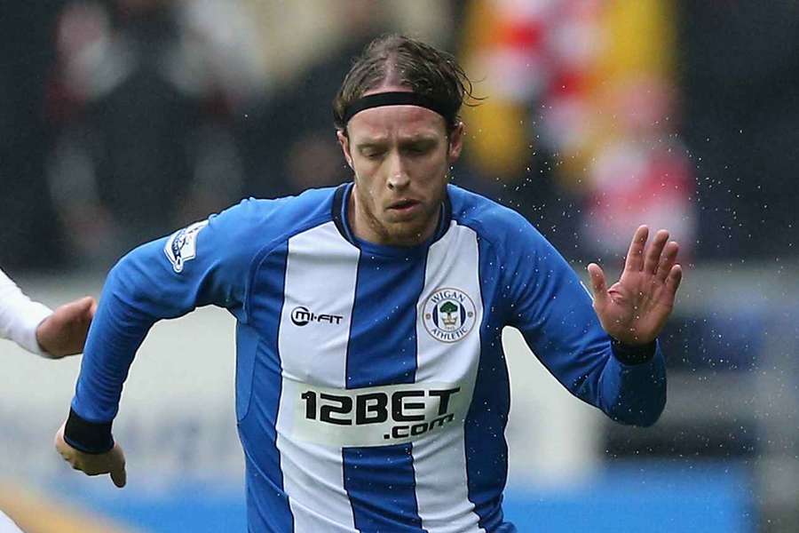 Ronnie Stam in action for Wigan Athletic in a Premier League match against Arsenal
