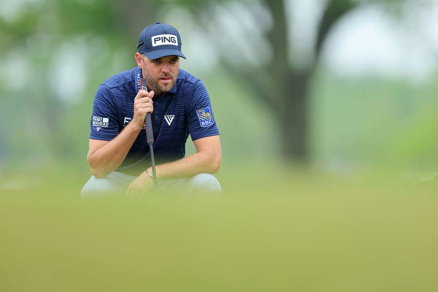 Corey Conners of Canada lines up a putt