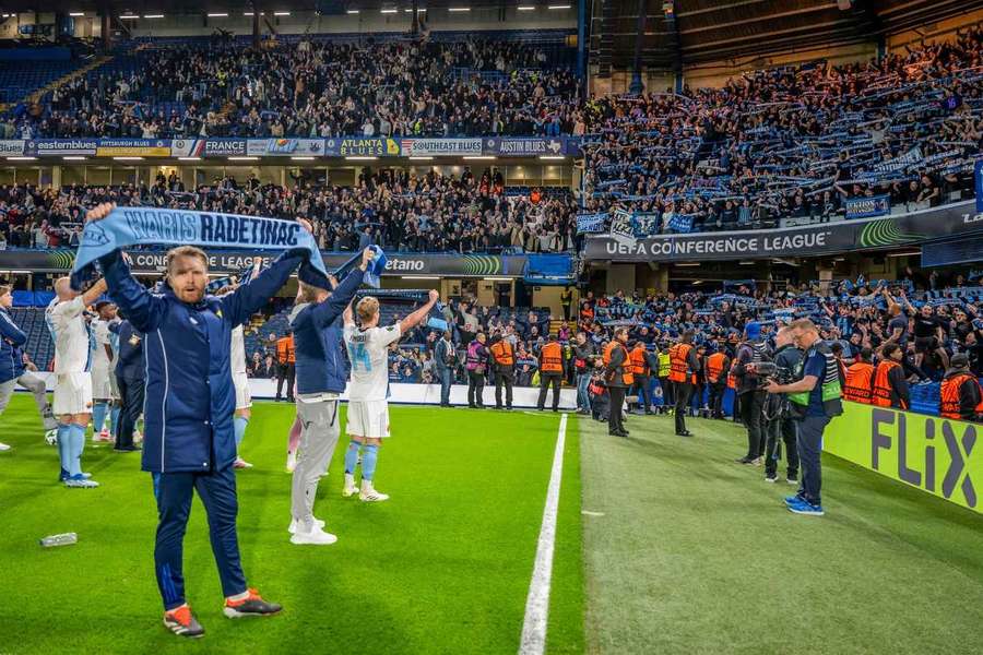 Jacob Une (foreground) celebrates with Djurgarden fans and teammates despite UECL exit