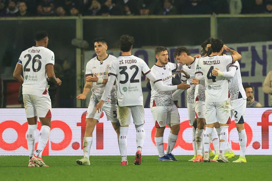  Marco Palestra celebrates with his Cagliari teammates after scoring a goal