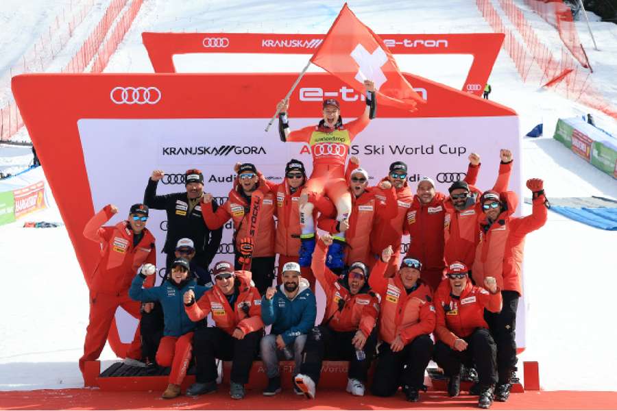 Marco Odermatt celebrates with his team after winning the men's giant slalom