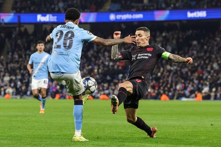 Man City's Savinho battles with Bayer Leverkusen's Alex Grimaldo Man City's Savinho battles with Bayer Leverkusen's Alex Grimaldo