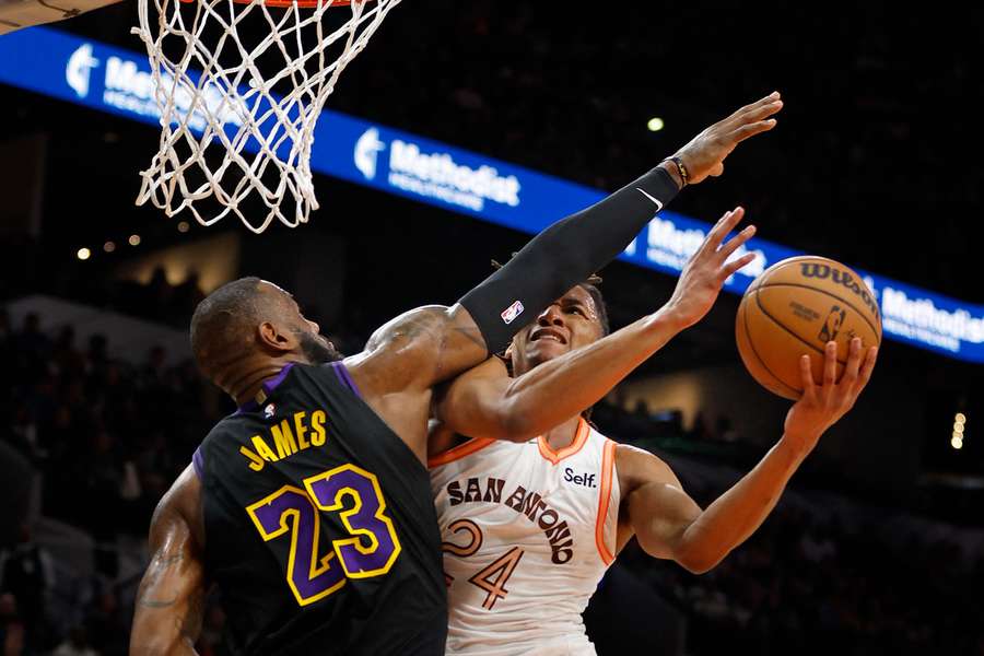 San Antonio's Devin Vassell is fouled by LeBron James of the Los Angeles Lakers in the Spurs' NBA victory over the Lakers