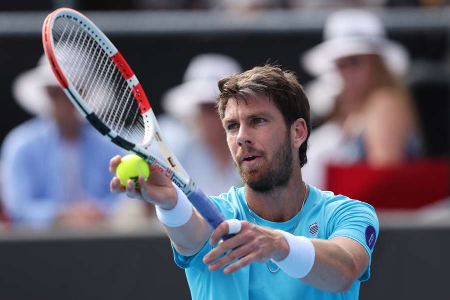 Cameron Norrie serves during the Auckland Open