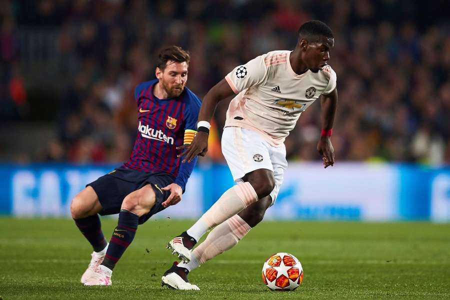 Paul Pogba dribbles away from Lionel Messi in the 2018/19 Champions League Paul Pogba dribbles away from Lionel Messi in the 2018/19 Champions League