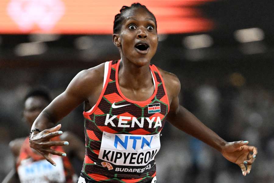 Faith Kipyegon reacts after winning her third world title