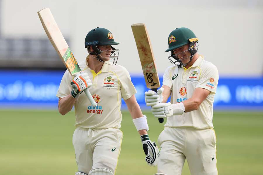 Steve Smith (L) and Marnus Labuschagne of Australia leave the ground on the second day between Australia and the West Indies