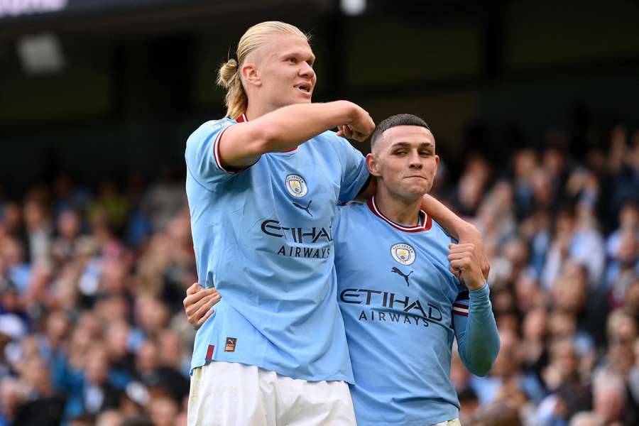 Manchester City's Phil Foden celebrates scoring his team's sixth goal and his third with striker Erling Haaland