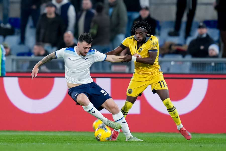 Hassane Kamara of Udinese and Mario Gila of Lazio compete for the ball