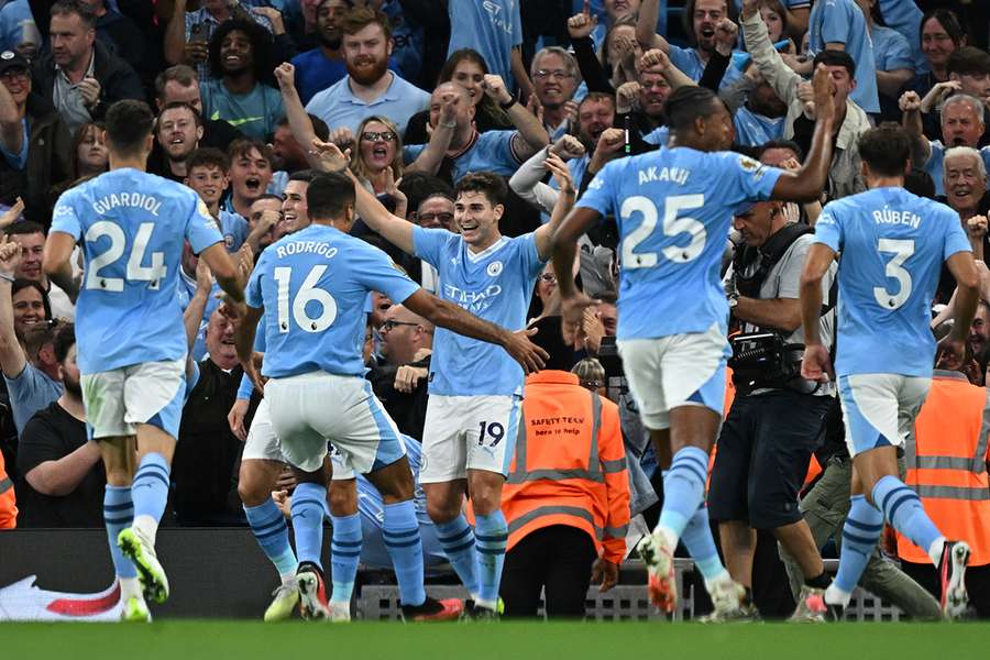 Alvarez celebrates with his Man City teammates