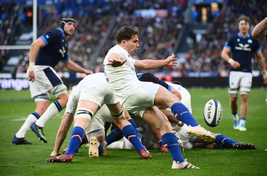 France's scrum-half Antoine Dupont kicks the ball