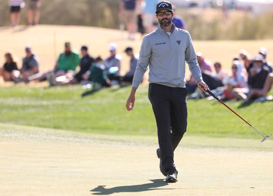 Adam Hadwin walks across the fourth green