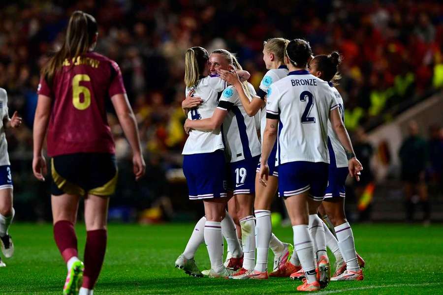 England celebrating one of their five goals in their win over Belgium.