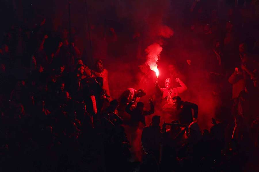 A Galatasaray fan with a flare during the Juventus game