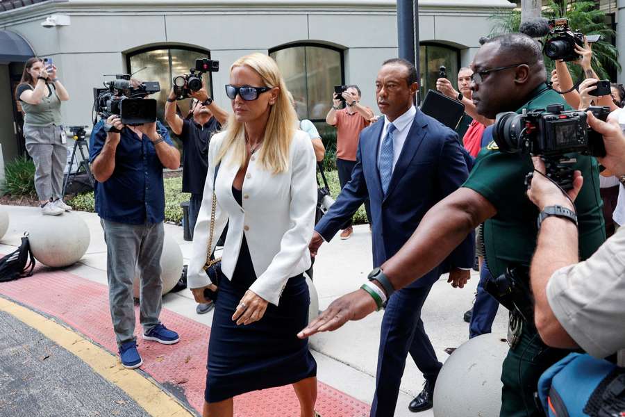 Tiger Woods flanked by his girlfriend, Vanessa Trump, leaves the courthouse Tiger Woods flanked by his girlfriend, Vanessa Trump, leaves the courthouse