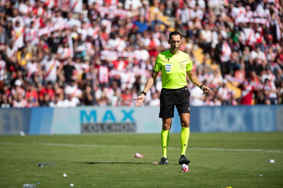 Referee Jose Maria Sanchez Martinez was forced to abandon the game Referee Jose Maria Sanchez Martinez was forced to abandon the game